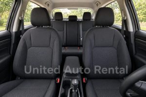 2026 Nissan Kicks "Compact SUV" five-passenger interior with two front seats and a three-seat rear bench, available from United Auto Rental in Orange County and Ontario.